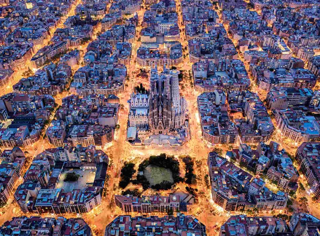 Aerial view of Barcelona with Diagonal Avenue and square blocks and Sagrada Familia