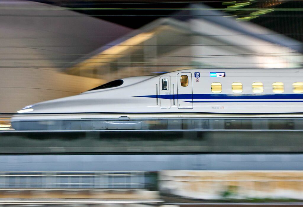 Tokyo, Japan - September 4, 2014: N700 series Shinkansen bullet train approaches Tokyo Station in the night.