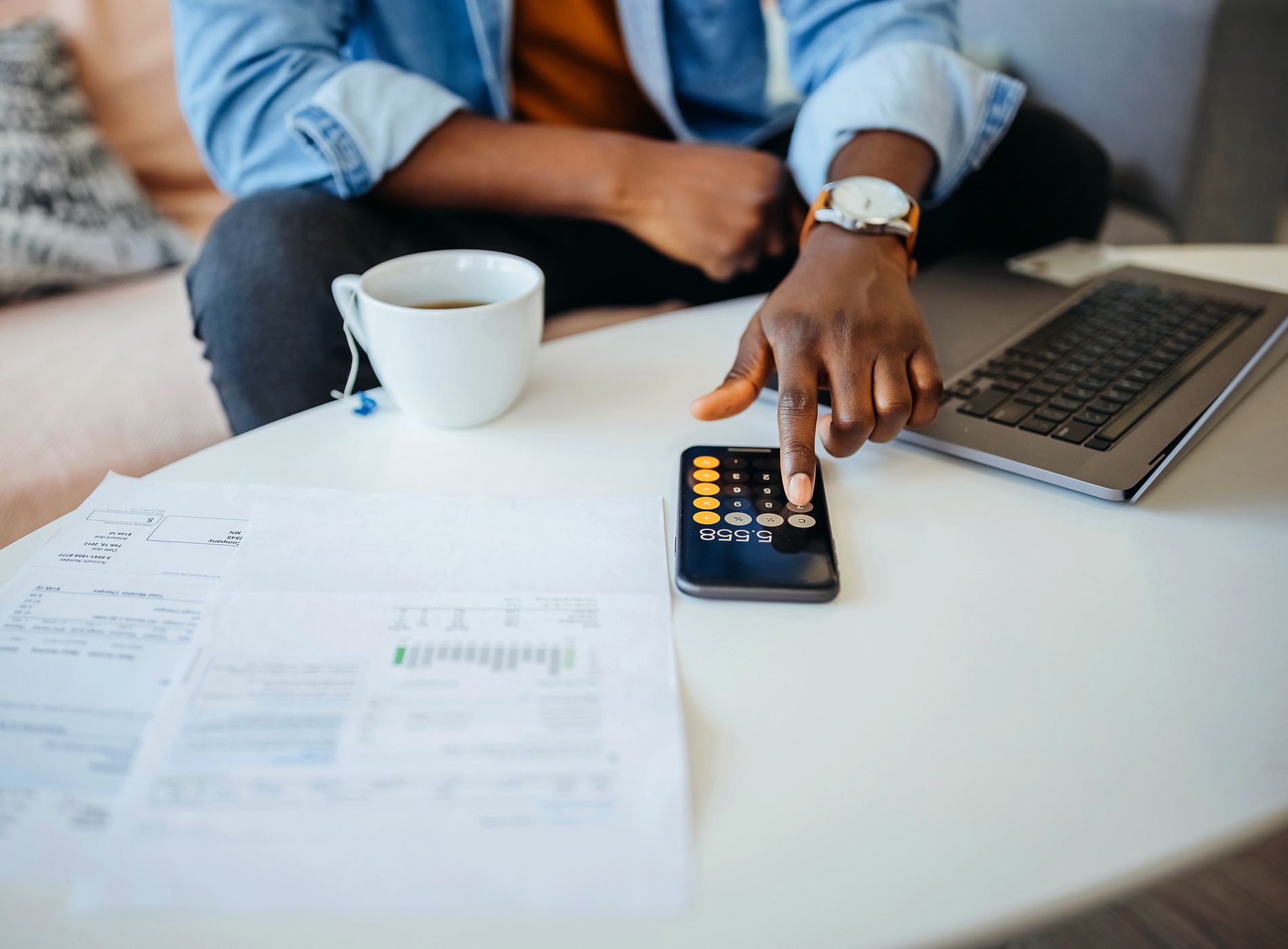 Unrecognisable man going over his finances