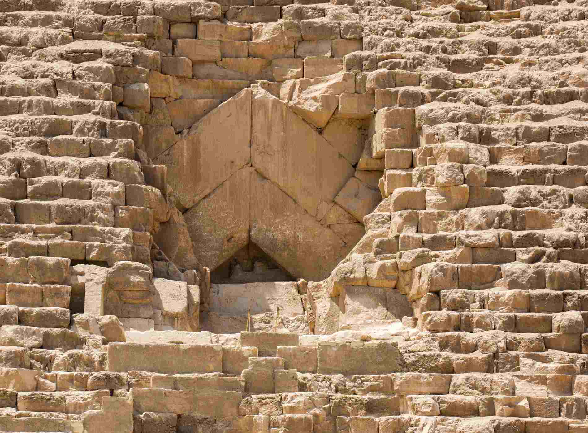 Giza, Egypt - July 18, 2016: The entrance to Pyramid of Khufu (aka the Great Pyramid of Giza or Pyramid of Cheops), a marvel of ancient engineering.